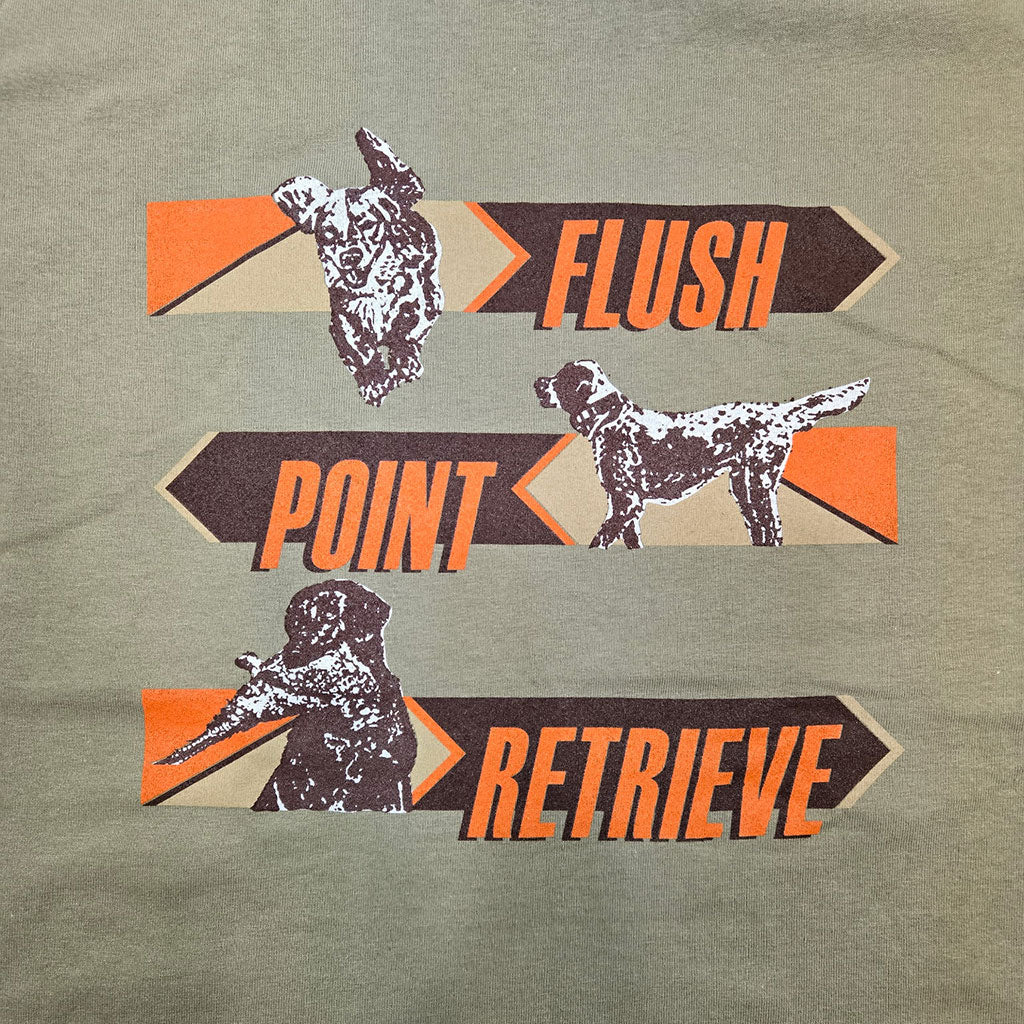 Close-up of Flush, Point, and Retrieve text design on Prairie Dust t-shirt